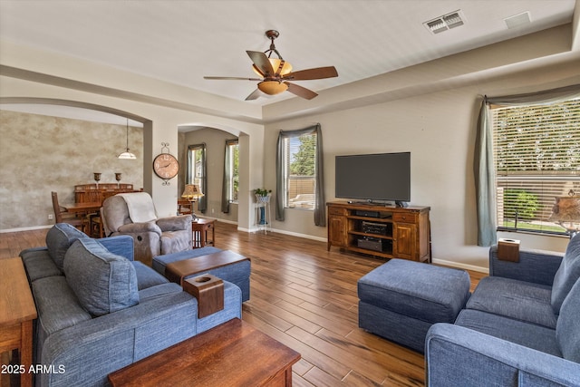 3225 E Cardinal Ct, Chandler, AZ 85286 - living area with arched walkways, wood finished floors, and ceiling fan