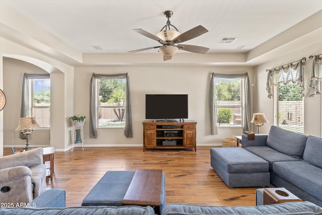 3225 E Cardinal Ct, Chandler, AZ 85286 - living area with wood finished floors, a ceiling fan, and arched walkways