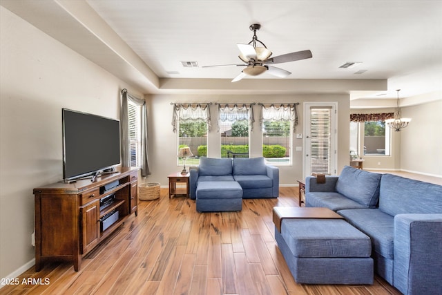 3225 E Cardinal Ct, Chandler, AZ 85286 - living area with ceiling fan, a chandelier, and light wood finished floors