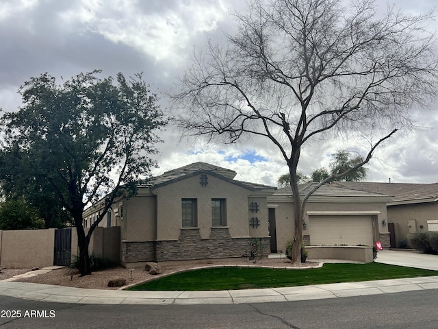 3225 E Cardinal Ct, Chandler, AZ 85286 - view of front of property featuring stucco siding, stone siding, concrete driveway, and a garage
