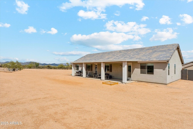 27420 N 170th St, Rio Verde, AZ 85263 - rear view of house with a mountain view, fence, a patio, and stucco siding