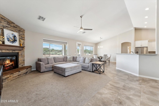 27420 N 170th St, Rio Verde, AZ 85263 - living room featuring ceiling fan, arched walkways, visible vents, a stone fireplace, and baseboards