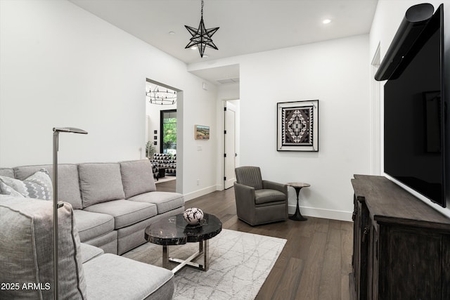 living room with baseboards, recessed lighting, and dark wood-type flooring