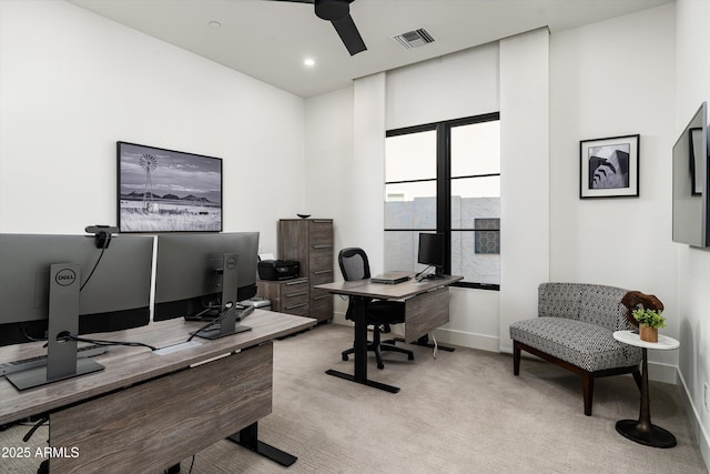 office with light colored carpet, baseboards, ceiling fan, and visible vents