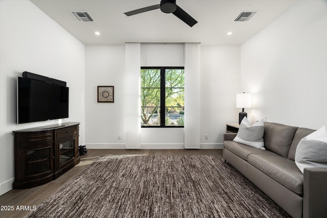 living room featuring a ceiling fan, dark wood-type flooring, recessed lighting, and visible vents