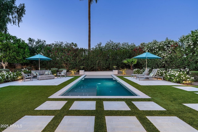 view of pool featuring an outdoor hangout area, a fenced in pool, a yard, and a patio area