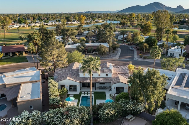 aerial view with a water and mountain view and a residential view