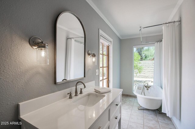 4079 E Shangri La Rd, Phoenix, AZ 85028 - bathroom with a textured wall, crown molding, vanity, a freestanding tub, and tile patterned floors
