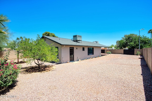 4079 E Shangri La Rd, Phoenix, AZ 85028 - back of house featuring cooling unit, a fenced backyard, and roof with shingles