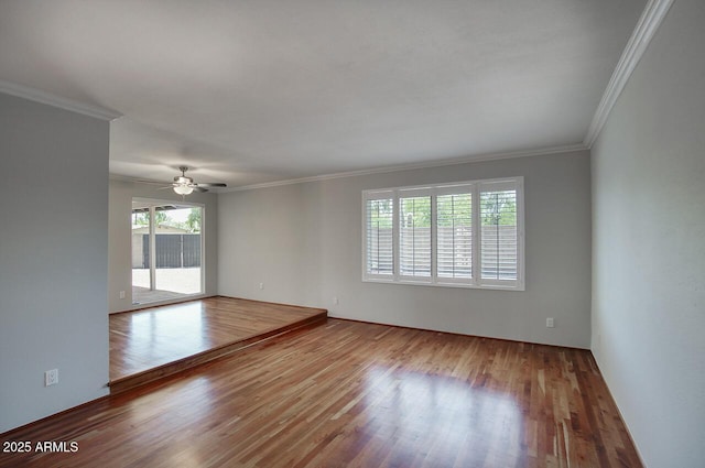 4079 E Shangri La Rd, Phoenix, AZ 85028 - unfurnished room featuring plenty of natural light, wood finished floors, ornamental molding, and a ceiling fan