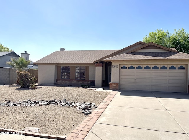 ranch-style home with fence, driveway, roof with shingles, an attached garage, and brick siding