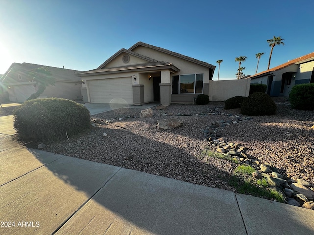 ranch-style house featuring a garage