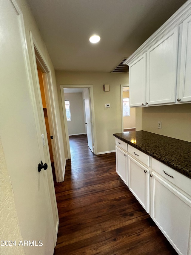 corridor featuring dark hardwood / wood-style floors