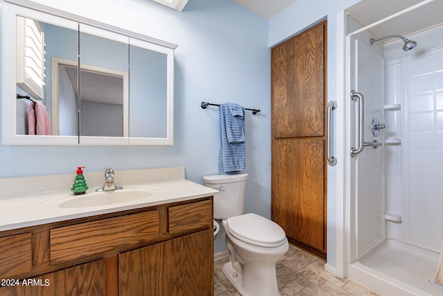 full bath with a shower stall, toilet, and vanity