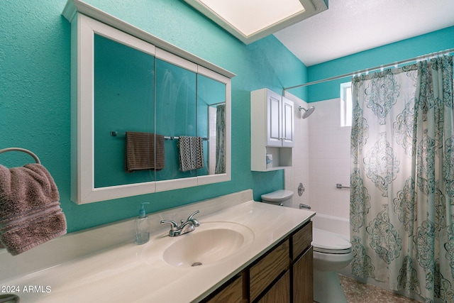 full bathroom featuring toilet, a textured wall, shower / bathtub combination with curtain, and vanity