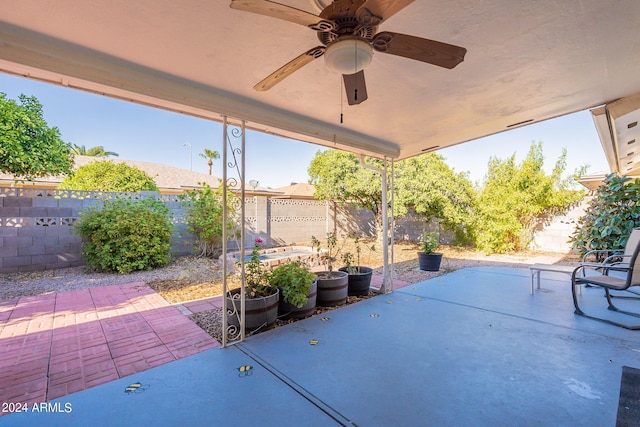 view of patio / terrace with a fenced backyard and a ceiling fan