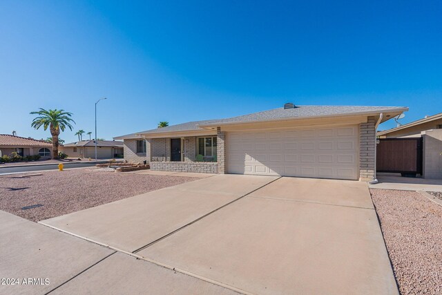 single story home with a garage