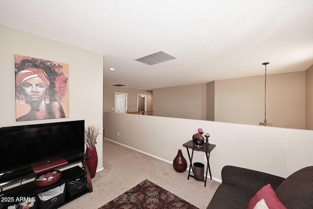 living room with carpet floors, recessed lighting, visible vents, and baseboards