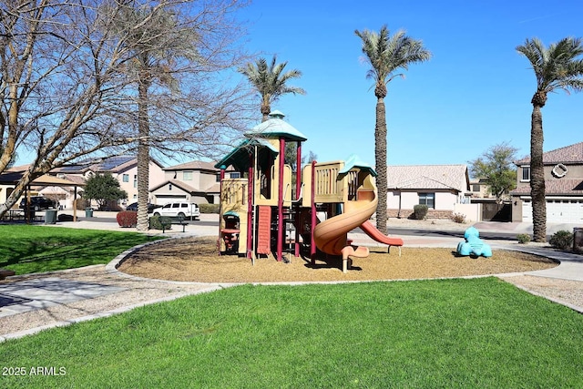 community playground featuring a lawn