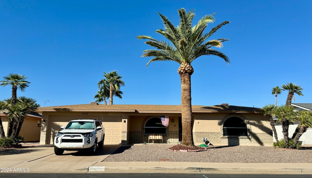 ranch-style house featuring a garage