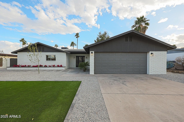 ranch-style home with a garage and a front yard