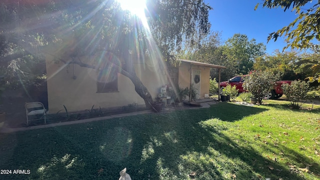 view of side of home featuring a yard