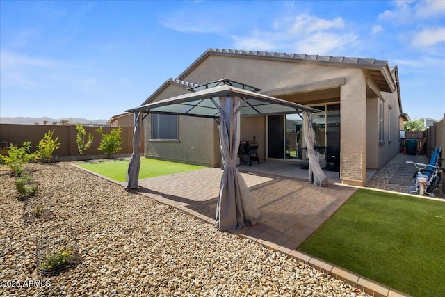 19447 W Mariposa Dr, Litchfield Park, AZ 85340 - rear view of property featuring stucco siding and a gazebo