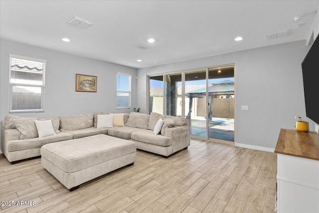 19447 W Mariposa Dr, Litchfield Park, AZ 85340 - living area with light wood-type flooring, recessed lighting, and baseboards