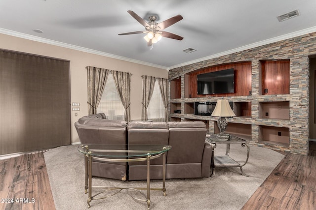 living room with crown molding, ceiling fan, and hardwood / wood-style flooring