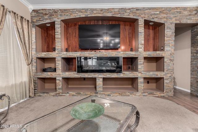 interior space with hardwood / wood-style floors and crown molding