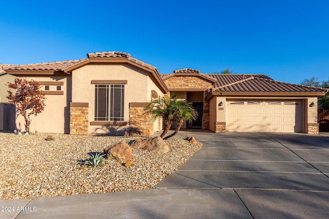 mediterranean / spanish-style house featuring a garage