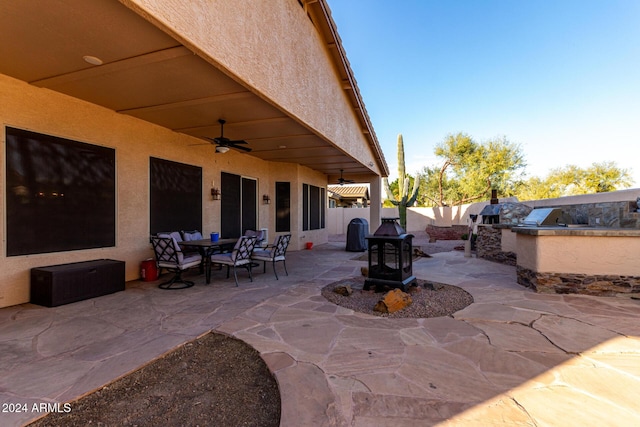 view of patio with ceiling fan and exterior kitchen