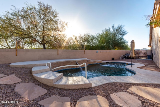 view of swimming pool featuring pool water feature