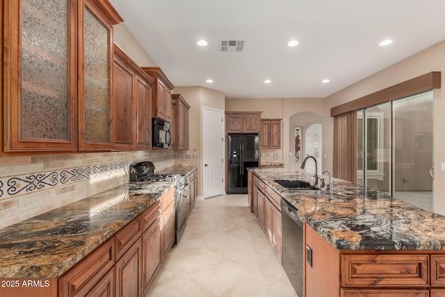 1260 E Sweet Citrus Dr, Queen Creek, AZ 85140 - kitchen featuring black appliances, arched walkways, a sink, recessed lighting, and decorative backsplash