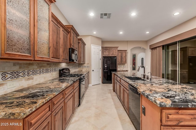 1260 E Sweet Citrus Dr, Queen Creek, AZ 85140 - kitchen with black appliances, a sink, arched walkways, recessed lighting, and backsplash