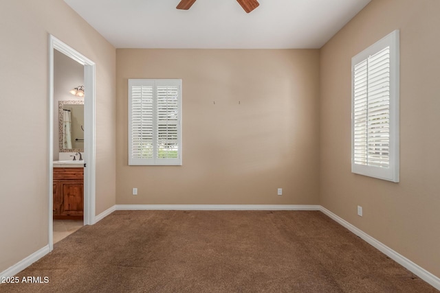 1260 E Sweet Citrus Dr, Queen Creek, AZ 85140 - carpeted spare room with a ceiling fan, a sink, and baseboards