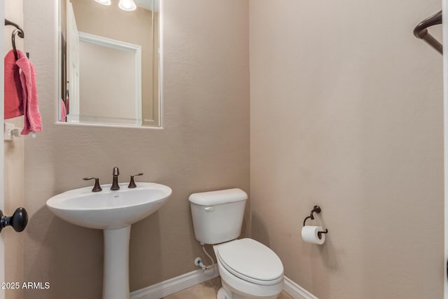 1260 E Sweet Citrus Dr, Queen Creek, AZ 85140 - bathroom featuring toilet, a sink, and baseboards