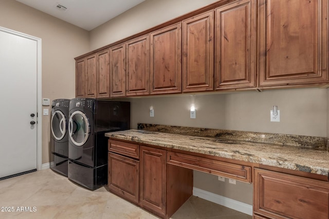 1260 E Sweet Citrus Dr, Queen Creek, AZ 85140 - clothes washing area featuring washer and clothes dryer, cabinet space, a desk, light tile patterned floors, and baseboards