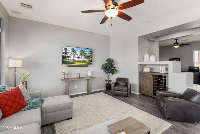 13072 W Alyssa Ln, Peoria, AZ 85383 - living area with ceiling fan, wood finished floors, and baseboards