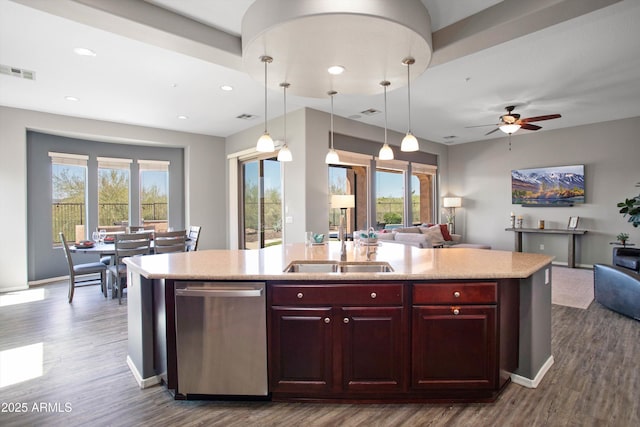13072 W Alyssa Ln, Peoria, AZ 85383 - kitchen featuring stainless steel dishwasher, open floor plan, a sink, a kitchen island with sink, and dark wood finished floors