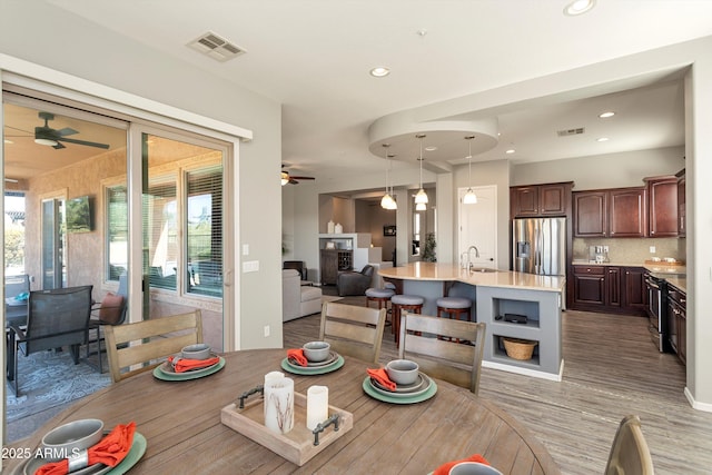 13072 W Alyssa Ln, Peoria, AZ 85383 - dining area with ceiling fan, wood finished floors, and recessed lighting