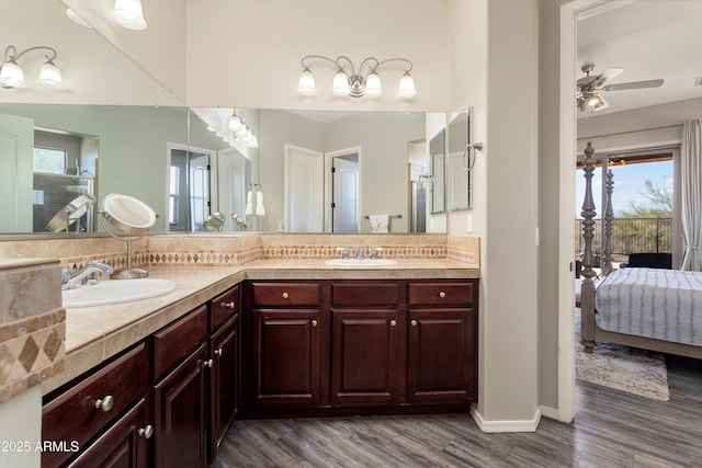 13072 W Alyssa Ln, Peoria, AZ 85383 - ensuite bathroom with double vanity, healthy amount of natural light, wood finished floors, and ceiling fan