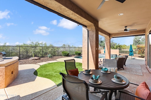 13072 W Alyssa Ln, Peoria, AZ 85383 - fenced backyard with ceiling fan, a patio, and outdoor dining space