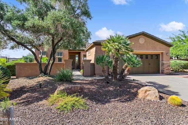 13072 W Alyssa Ln, Peoria, AZ 85383 - view of front of house with driveway, stucco siding, an attached garage, and a gate