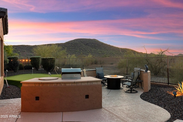 13072 W Alyssa Ln, Peoria, AZ 85383 - view of patio / terrace featuring an outdoor fire pit, a mountain view, and a grill