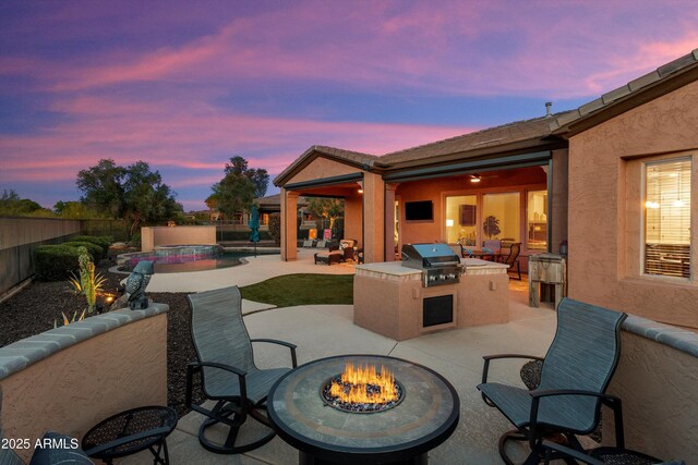13072 W Alyssa Ln, Peoria, AZ 85383 - fenced backyard featuring a fire pit, a patio, and a pool with connected hot tub