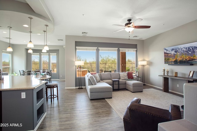 13072 W Alyssa Ln, Peoria, AZ 85383 - living room with recessed lighting, dark wood-style floors, a ceiling fan, and baseboards