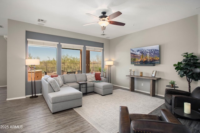 13072 W Alyssa Ln, Peoria, AZ 85383 - living area with baseboards, wood finished floors, and a ceiling fan