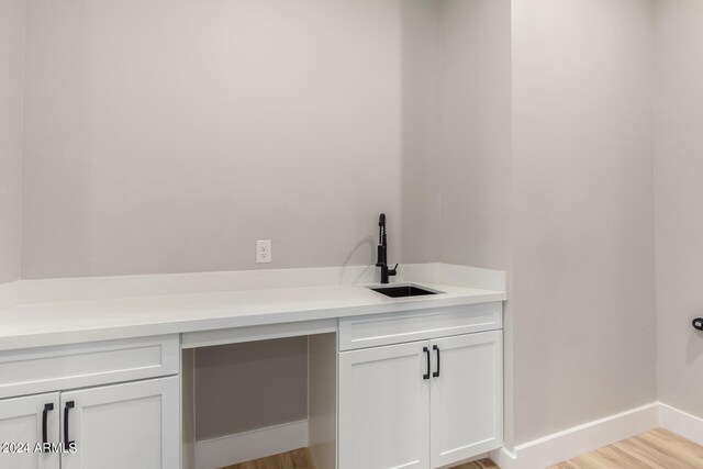 details with wood-type flooring and sink