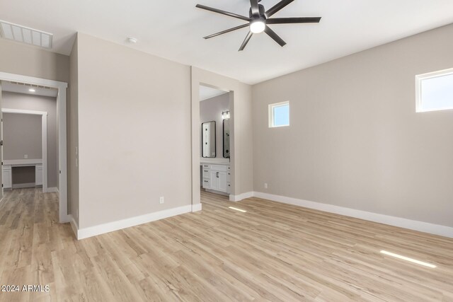 spare room with light hardwood / wood-style flooring, ceiling fan, and plenty of natural light